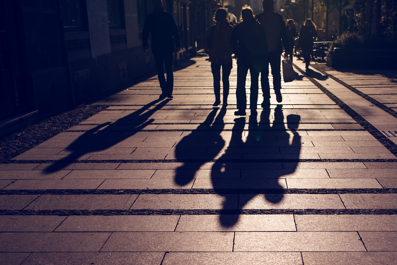 People walking along road.